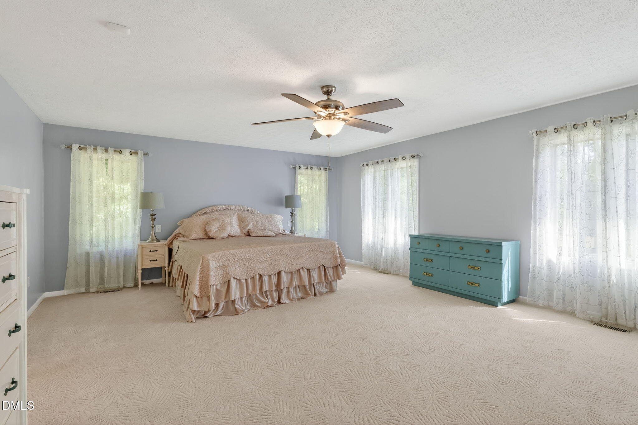 5363 Scottie Godwin Road Wade, NC 28395 - Photo 45 of 87 a spacious bedroom with a bed and a window