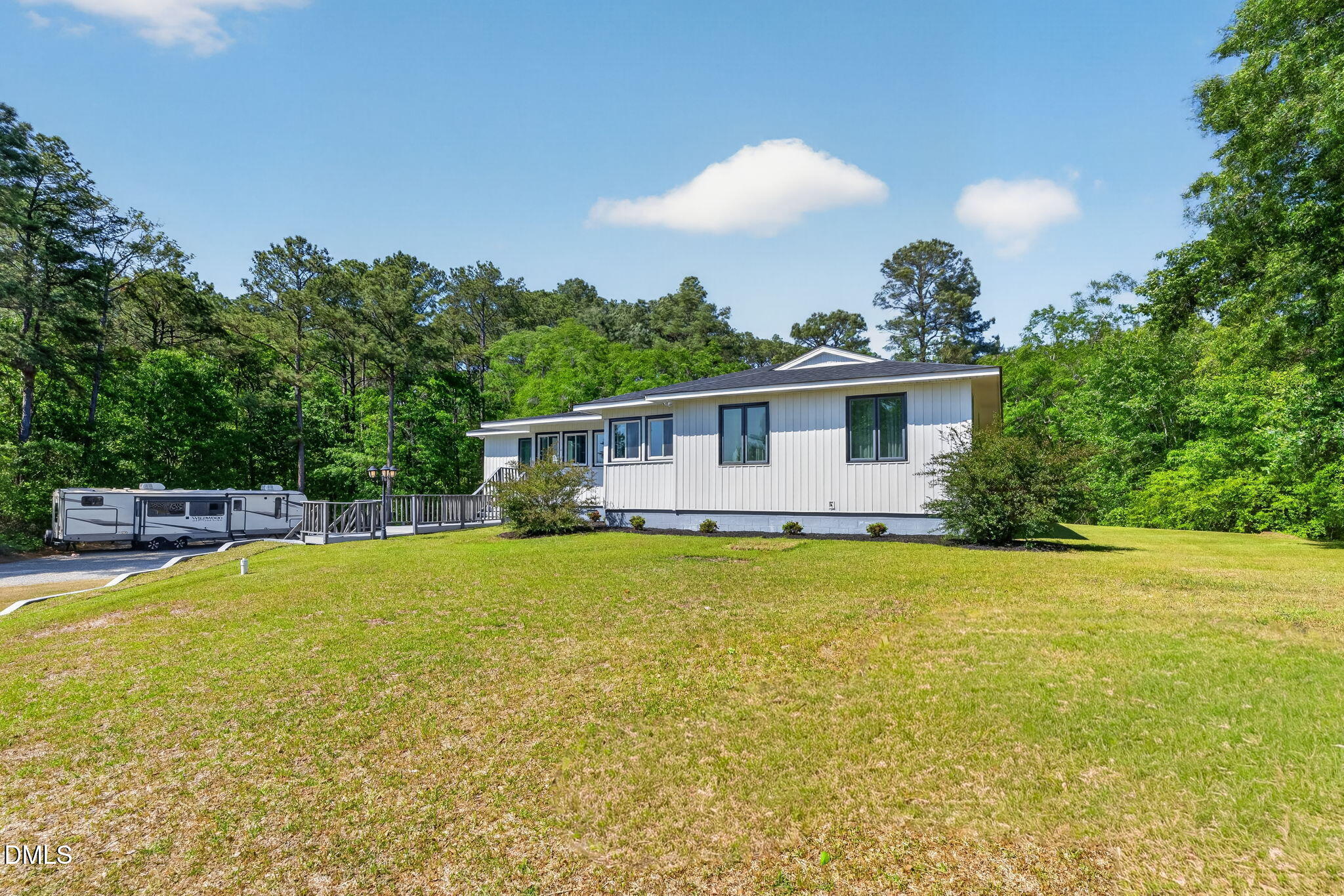 5363 Scottie Godwin Road Wade, NC 28395 - Photo 5 of 87 a view of a house with swimming pool and a yard