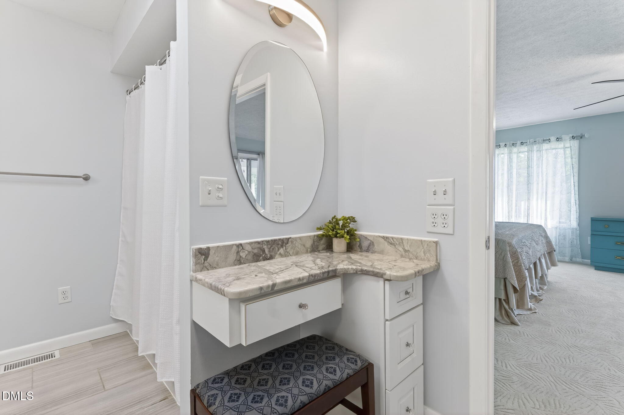 5363 Scottie Godwin Road Wade, NC 28395 - Photo 54 of 87 a bathroom with a granite countertop sink mirror and a vanity