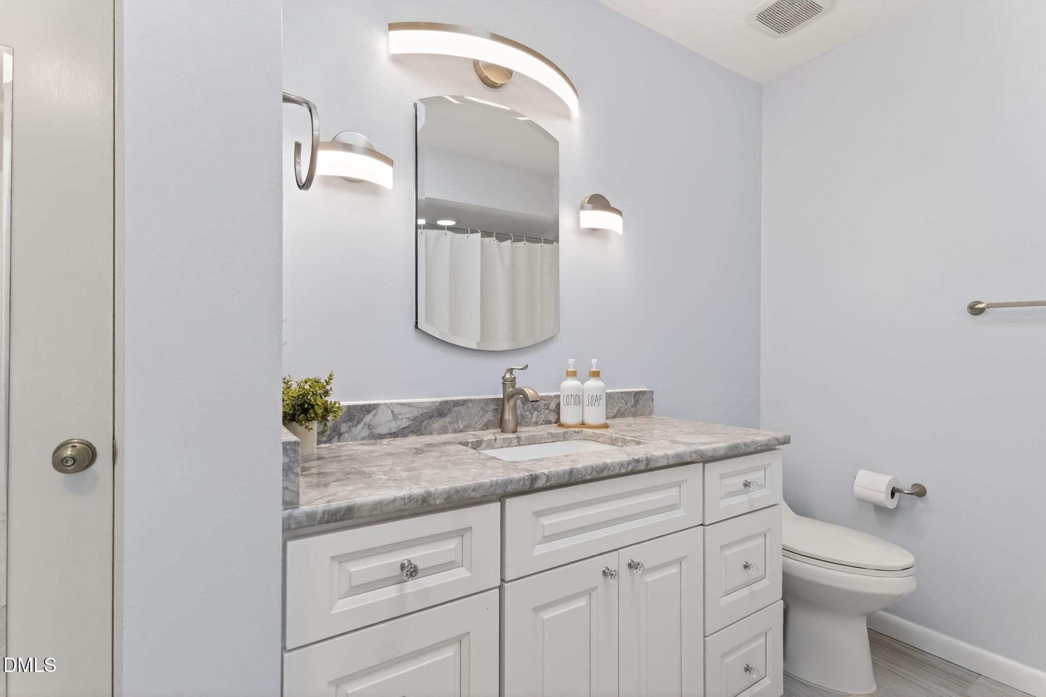 5363 Scottie Godwin Road Wade, NC 28395 - Photo 55 of 87 a bathroom with a granite countertop sink and a mirror