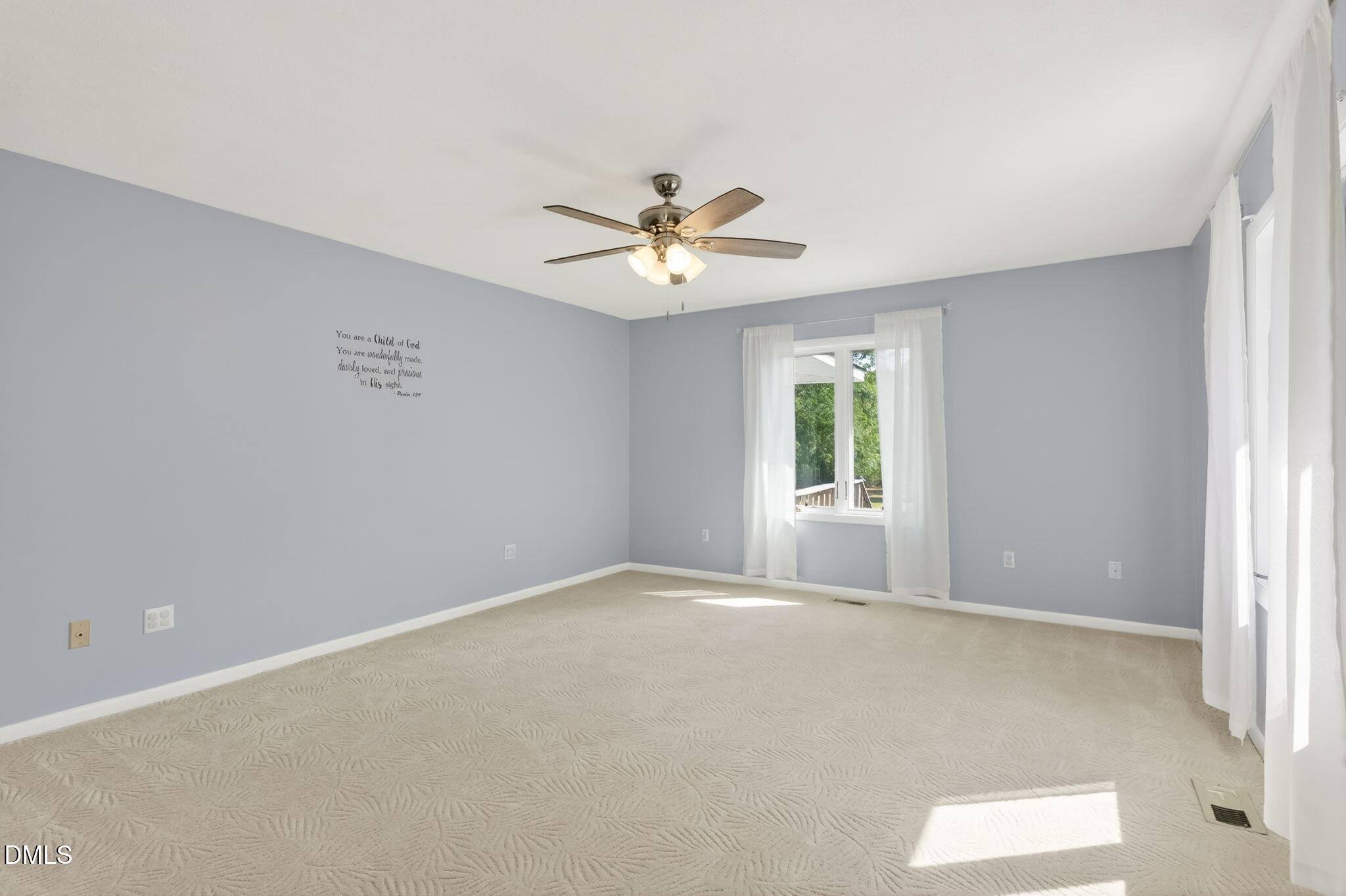 5363 Scottie Godwin Road Wade, NC 28395 - Photo 63 of 87 an empty room with a window and a ceiling fan