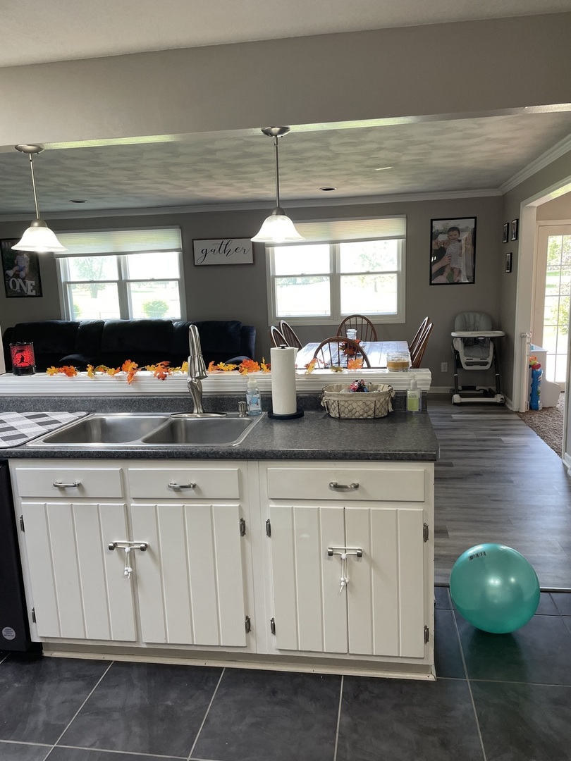1900 Melvin Road Rock Falls, IL 61071 - Photo 13 of 26 a kitchen with white cabinets and window