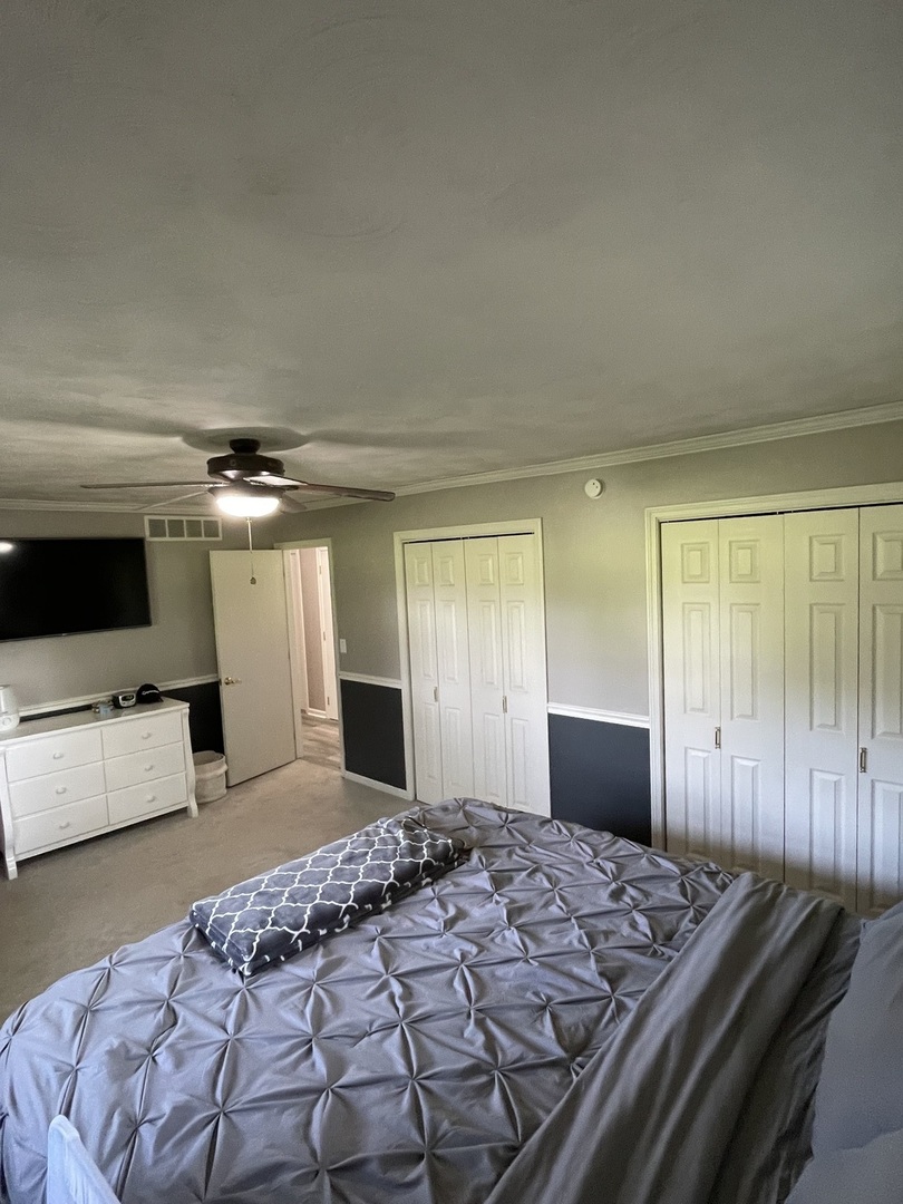 1900 Melvin Road Rock Falls, IL 61071 - Photo 6 of 26 a bedroom with a bed and a flat screen tv