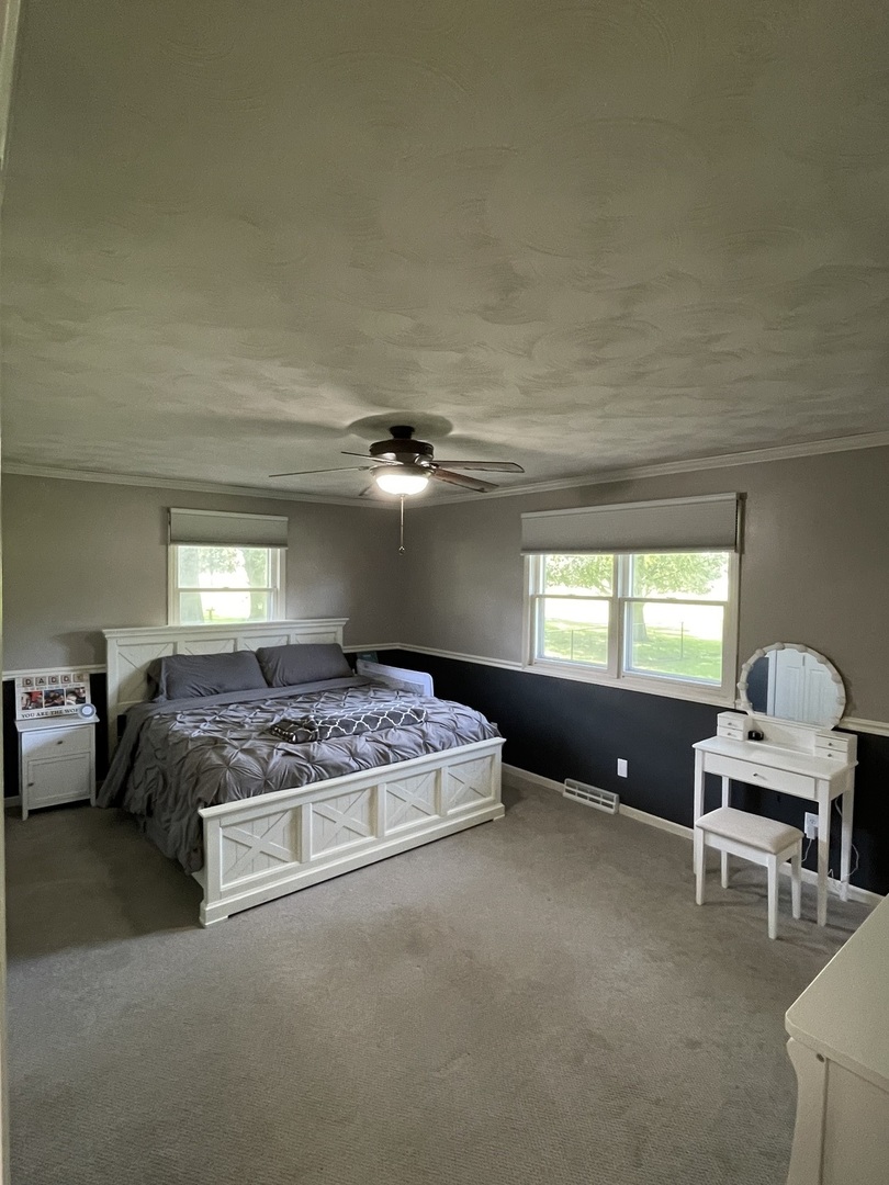 1900 Melvin Road Rock Falls, IL 61071 - Photo 7 of 26 a bedroom with a bed and furniture
