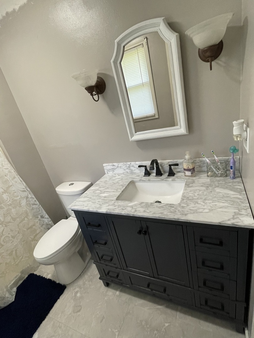 1900 Melvin Road Rock Falls, IL 61071 - Photo 8 of 26 a bathroom with a granite countertop sink and a mirror