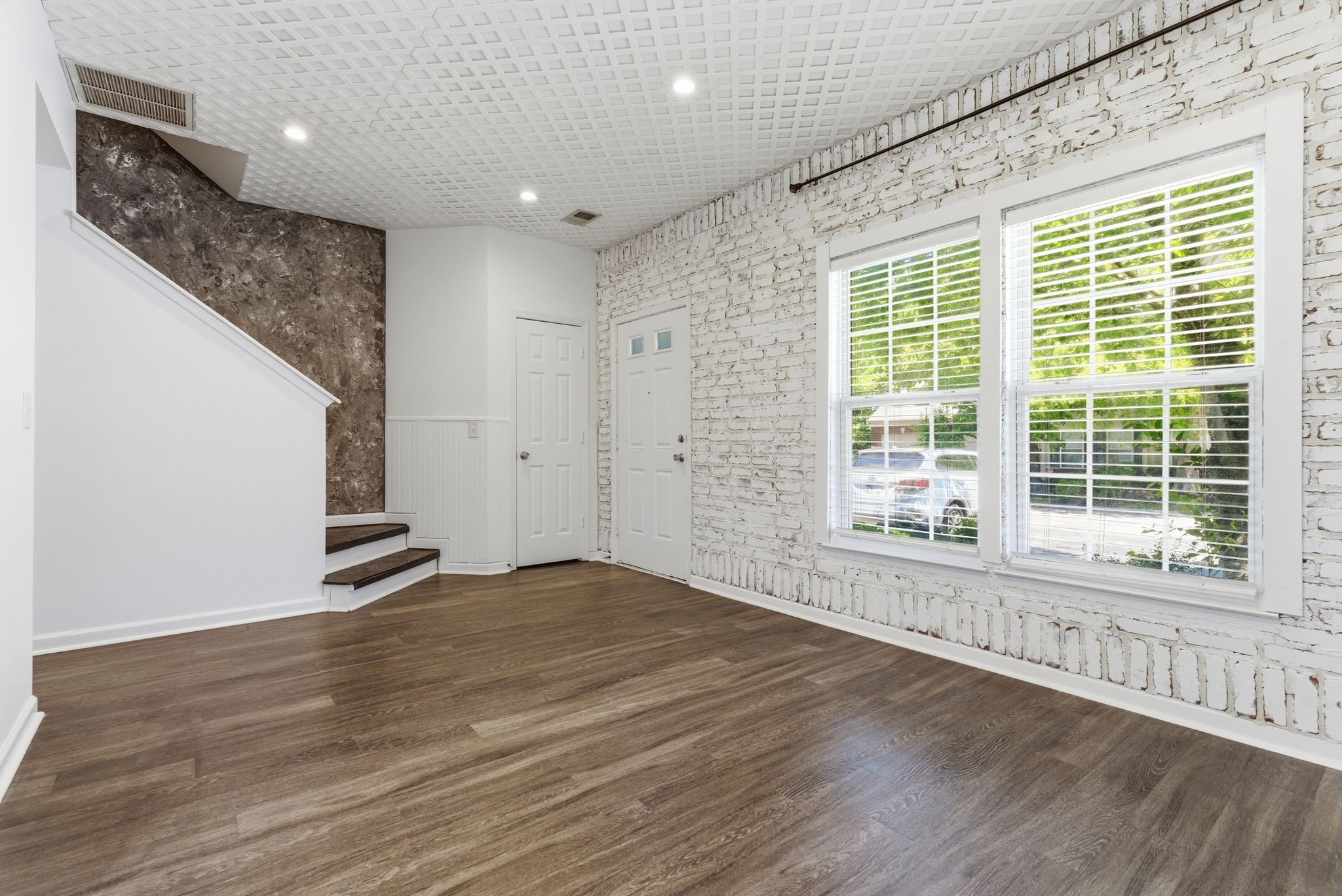 3401 Anderson Road, Unit 4 Antioch, TN 37013 - Photo 13 of 55 a view of an empty room with wooden floor and a window