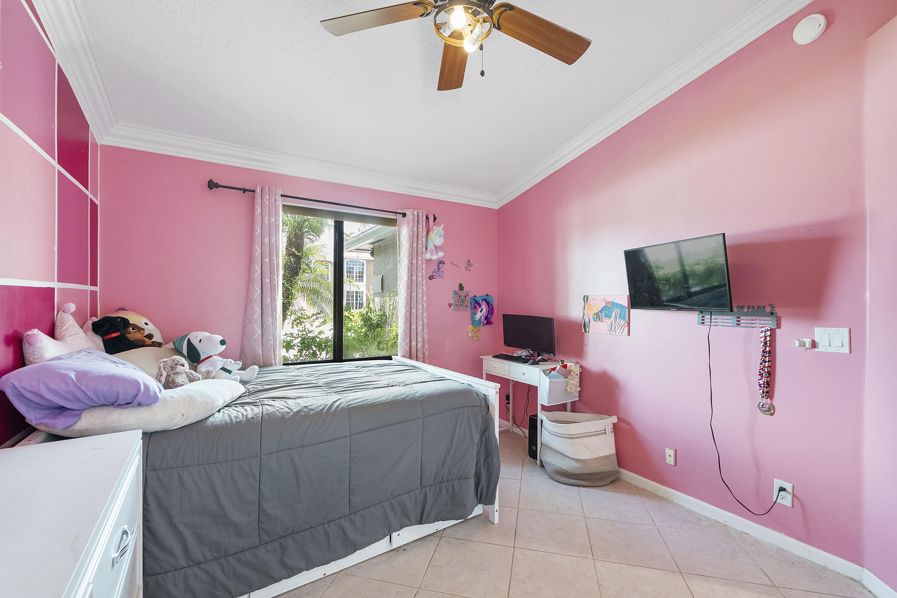12328 St Simon Drive Boca Raton, FL 33428 - Photo 30 of 52 a bedroom with a bed and a flat screen tv