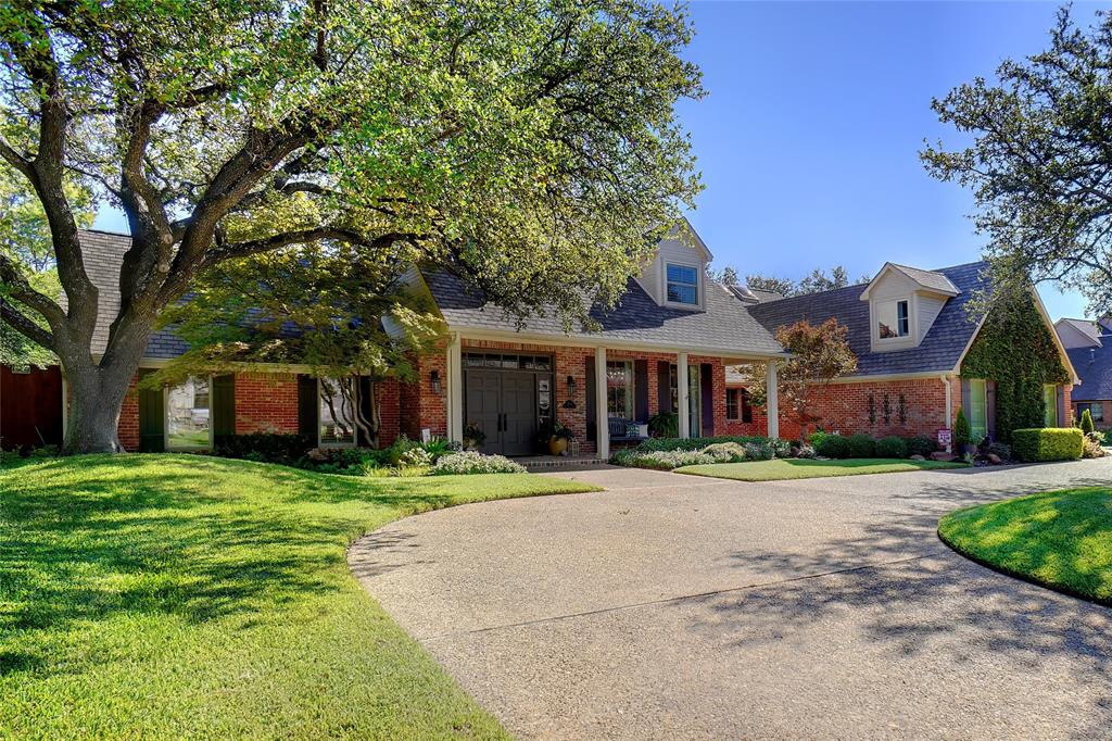 17512 River Hill Drive Dallas, TX 75287 - Photo 1 of 1 a front view of a house with a yard and trees