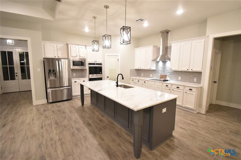 Tbd Tbd River Belton, TX 76513 - Photo 5 of 14 a kitchen with stainless steel appliances kitchen island a sink and a refrigerator
