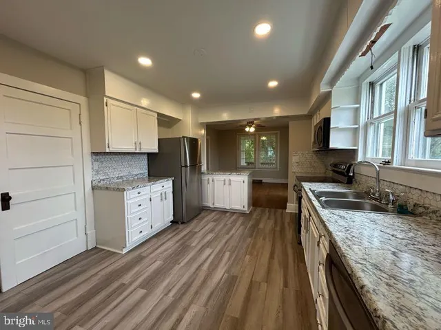 a bathroom with a glass door shower