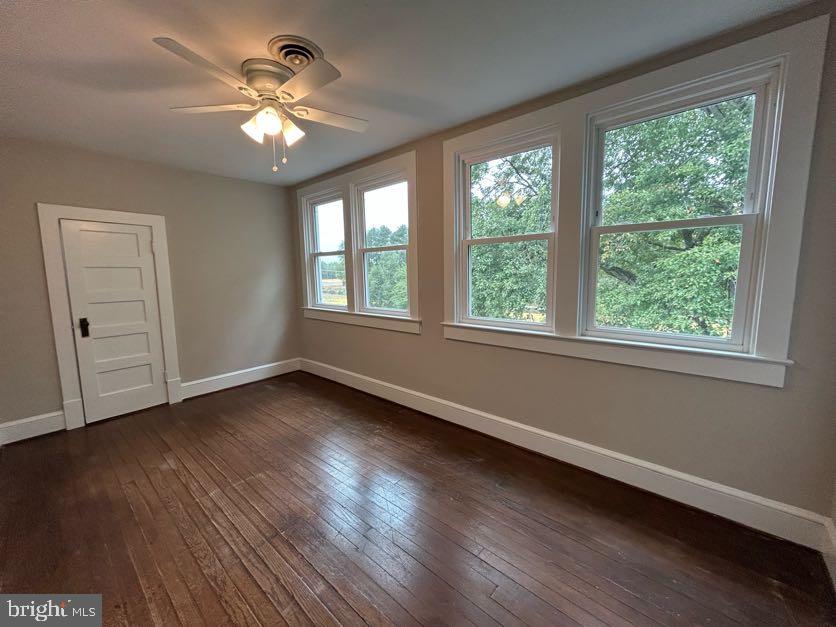 15471 U.S. Rte 1 Woodford, VA 22580 - Photo 28 of 74 a view of an empty room with wooden floor and a window