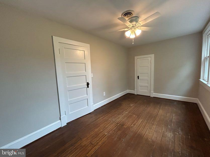 15471 U.S. Rte 1 Woodford, VA 22580 - Photo 29 of 74 wooden floor in an empty room with a window