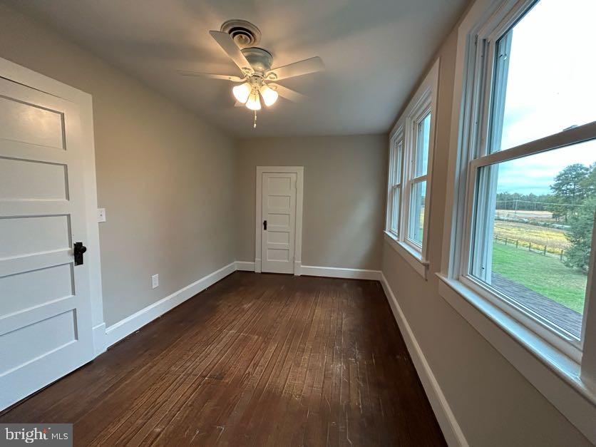 15471 U.S. Rte 1 Woodford, VA 22580 - Photo 30 of 74 wooden floor in an empty room with a window