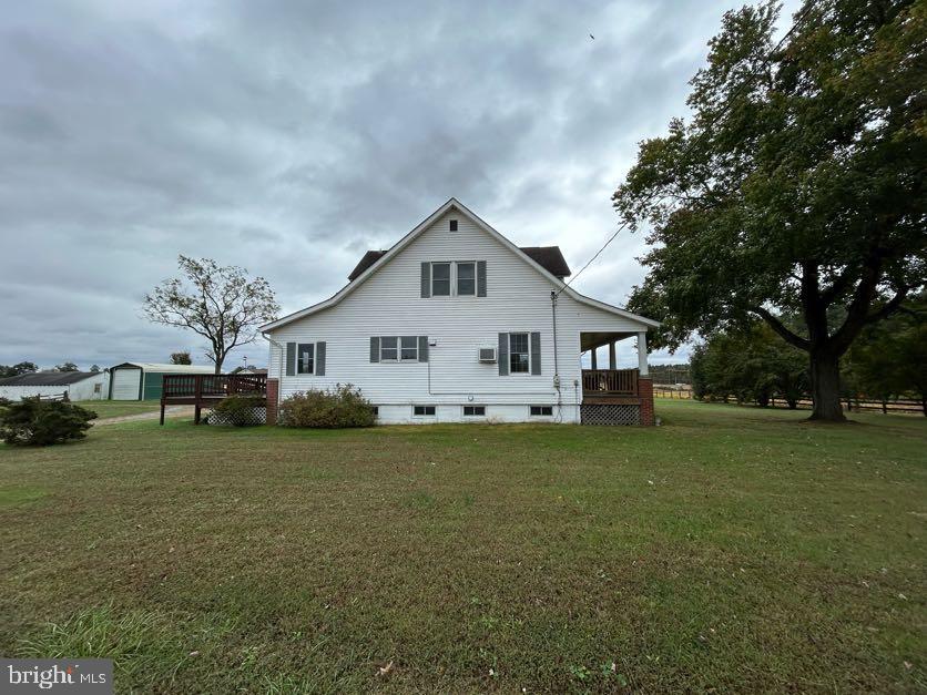 15471 U.S. Rte 1 Woodford, VA 22580 - Photo 60 of 74 a front view of house with yard and trees in the background