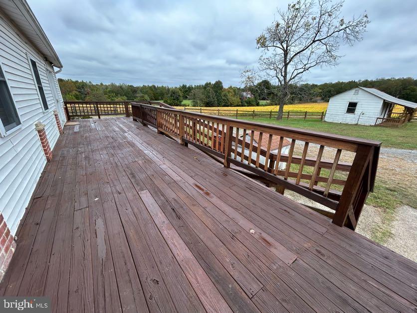 15471 U.S. Rte 1 Woodford, VA 22580 - Photo 66 of 74 a view of balcony with wooden floor and fence