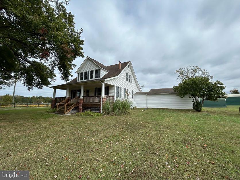 15471 U.S. Rte 1 Woodford, VA 22580 - Photo 72 of 74 a house that is sitting in the grass with large trees