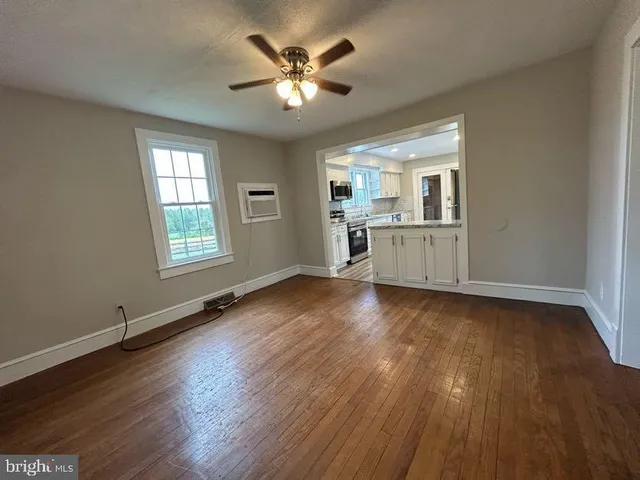 a kitchen with a refrigerator and a stove top oven