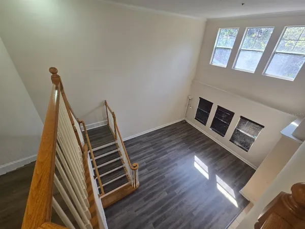 a bathroom with a tub sink vanity and a mirror