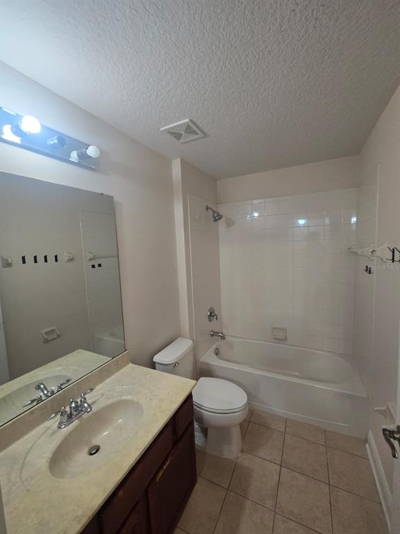 6930 Piazza Street Orlando, FL 32819 - Photo 20 of 25 a bathroom with a sink a toilet and shower