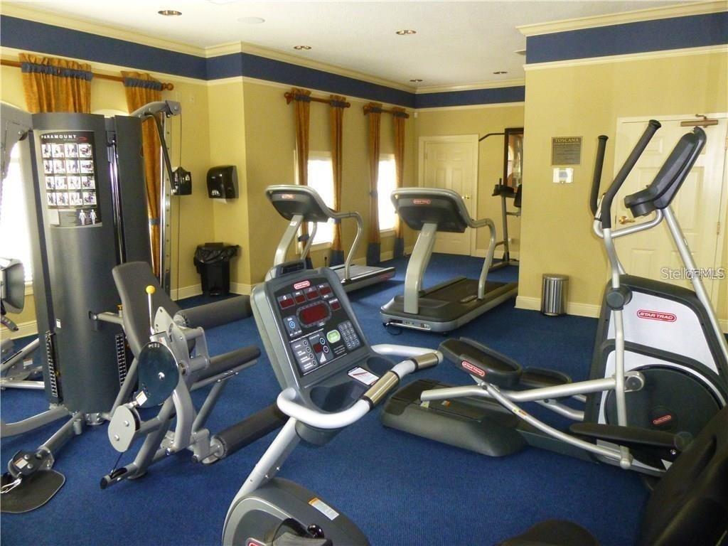 6930 Piazza Street Orlando, FL 32819 - Photo 23 of 25 a room with gym equipment