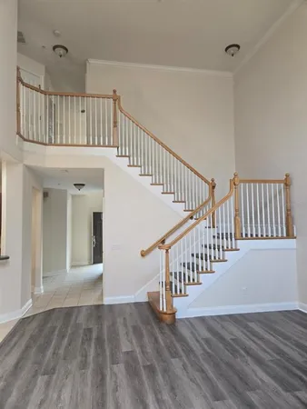 a kitchen with granite countertop a refrigerator and a sink