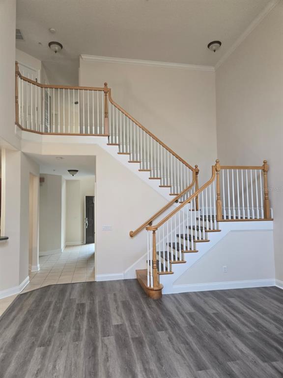 6930 Piazza Street Orlando, FL 32819 - Photo 5 of 25 a view of an entryway with wooden floor