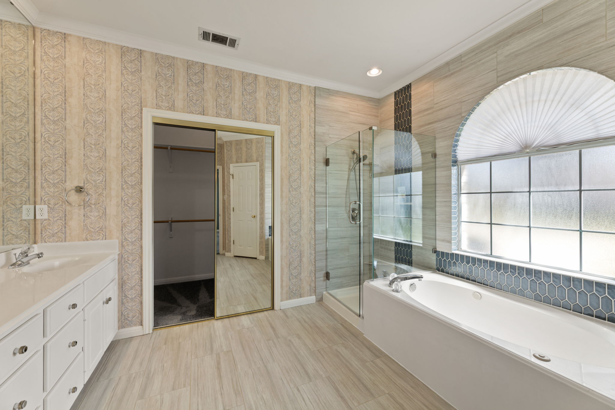 109 Riverview Drive Georgetown, TX 78628 - Photo 21 of 35 Bathroom with vanity, a bath, crown molding, a shower stall, and a spacious closet
