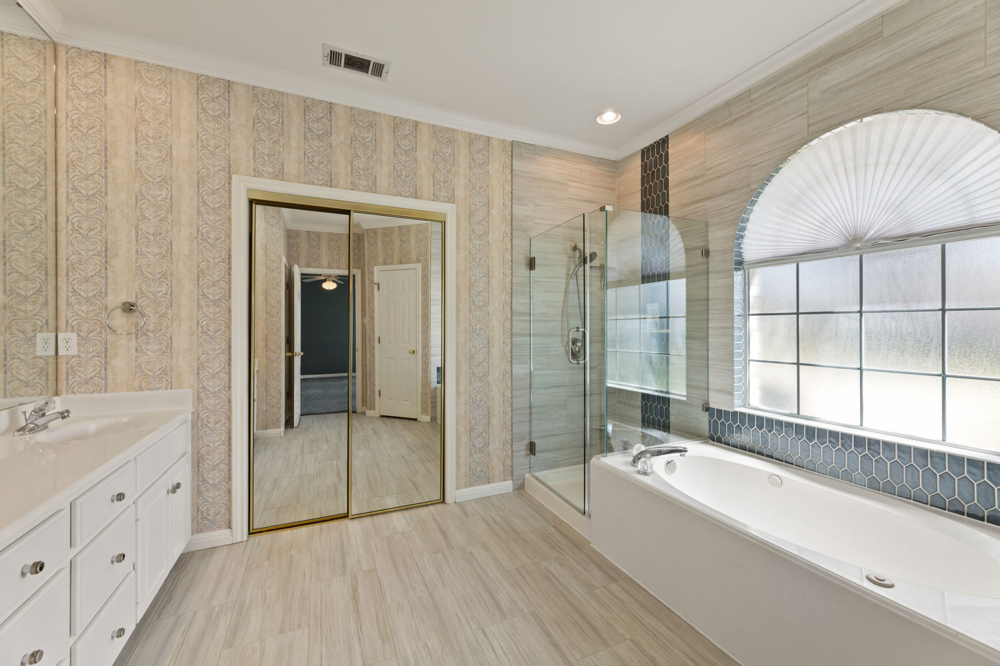 109 Riverview Drive Georgetown, TX 78628 - Photo 22 of 35 Full bath with vanity, a bath, a stall shower, ornamental molding, and recessed lighting