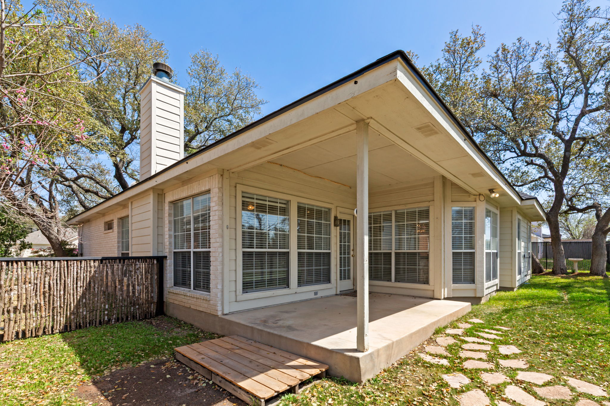 109 Riverview Drive Georgetown, TX 78628 - Photo 28 of 35 Back of property with a chimney and a patio area