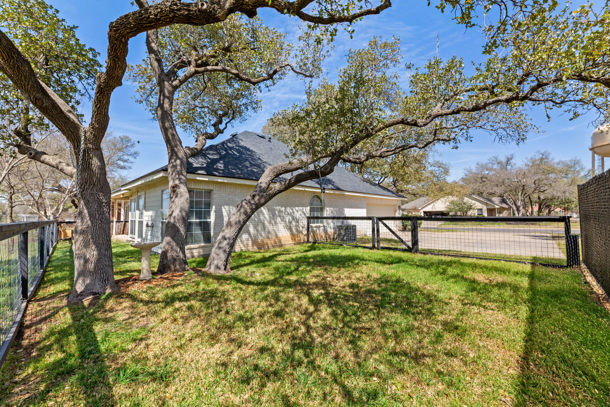 109 Riverview Drive Georgetown, TX 78628 - Photo 30 of 35 Fenced backyard with a gate and an attached garage