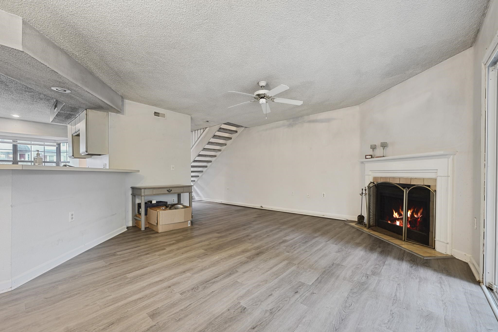 7632 Falcon Rest Circle, Unit 7632 Raleigh, NC 27615 - Photo 6 of 26 a view of a livingroom with furniture and a fireplace