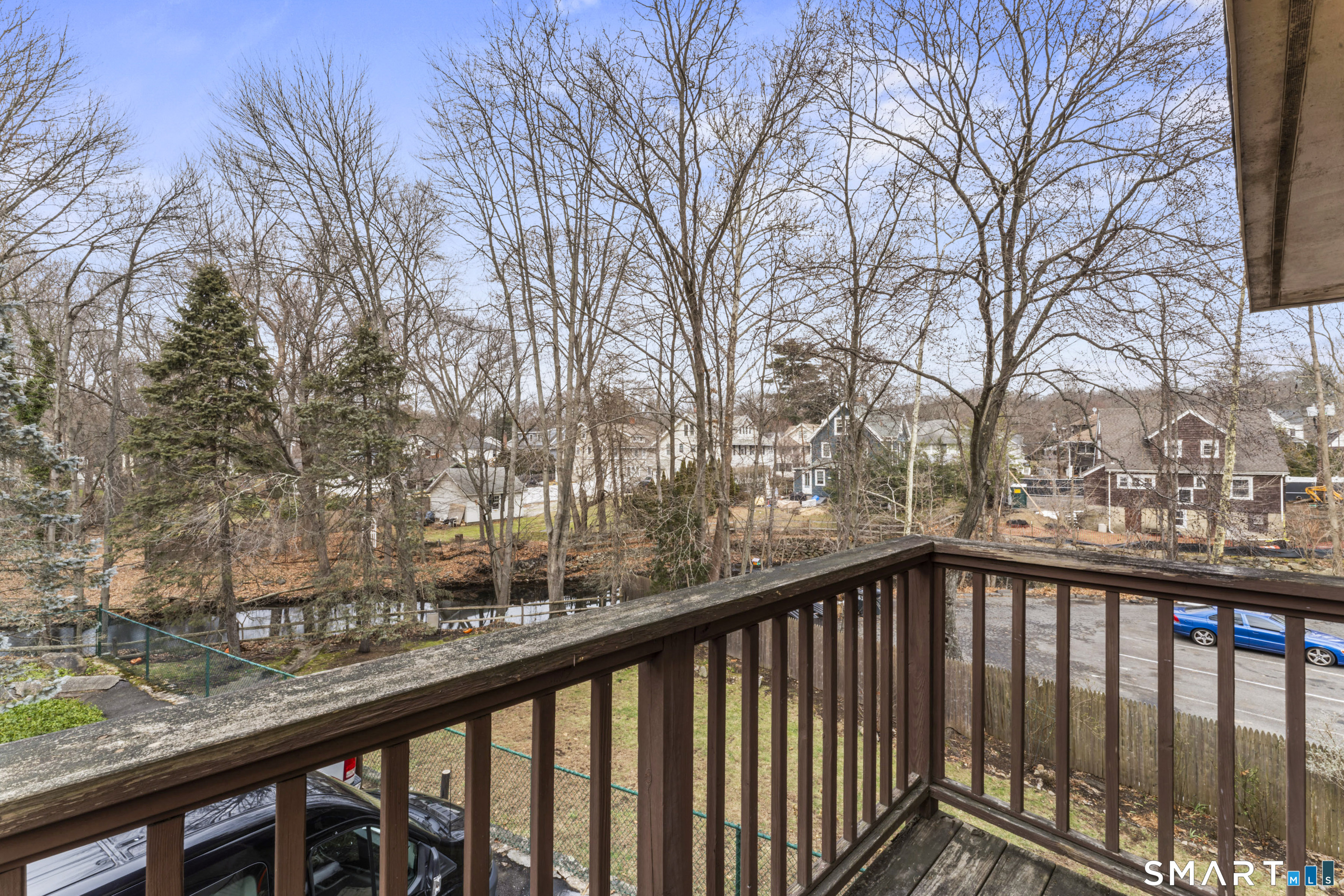 100 Maple Tree Avenue, Unit 7 Stamford, CT 06906 - Photo 12 of 38 a view of trees from a balcony