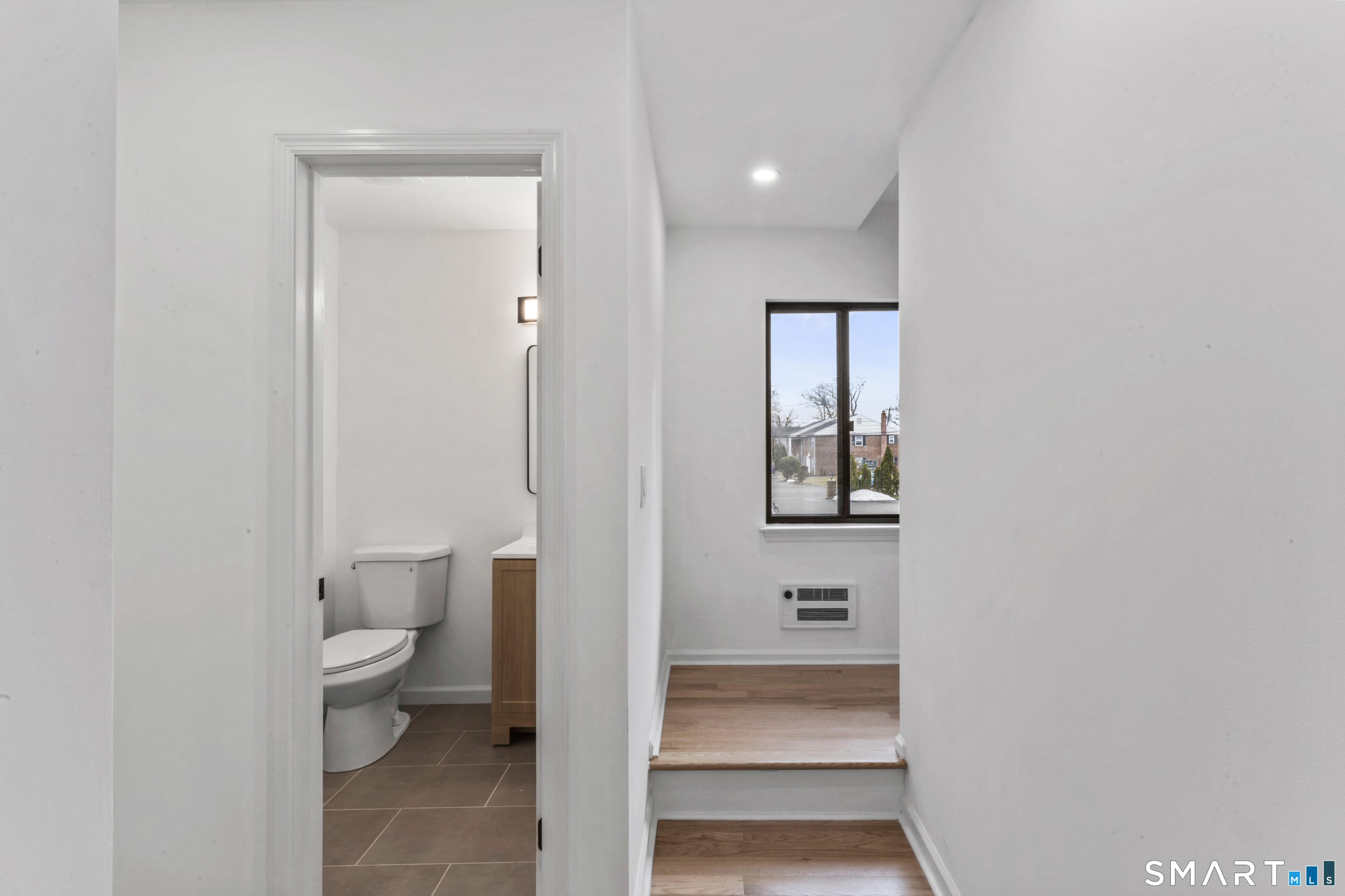 100 Maple Tree Avenue, Unit 7 Stamford, CT 06906 - Photo 14 of 38 a bathroom with a toilet