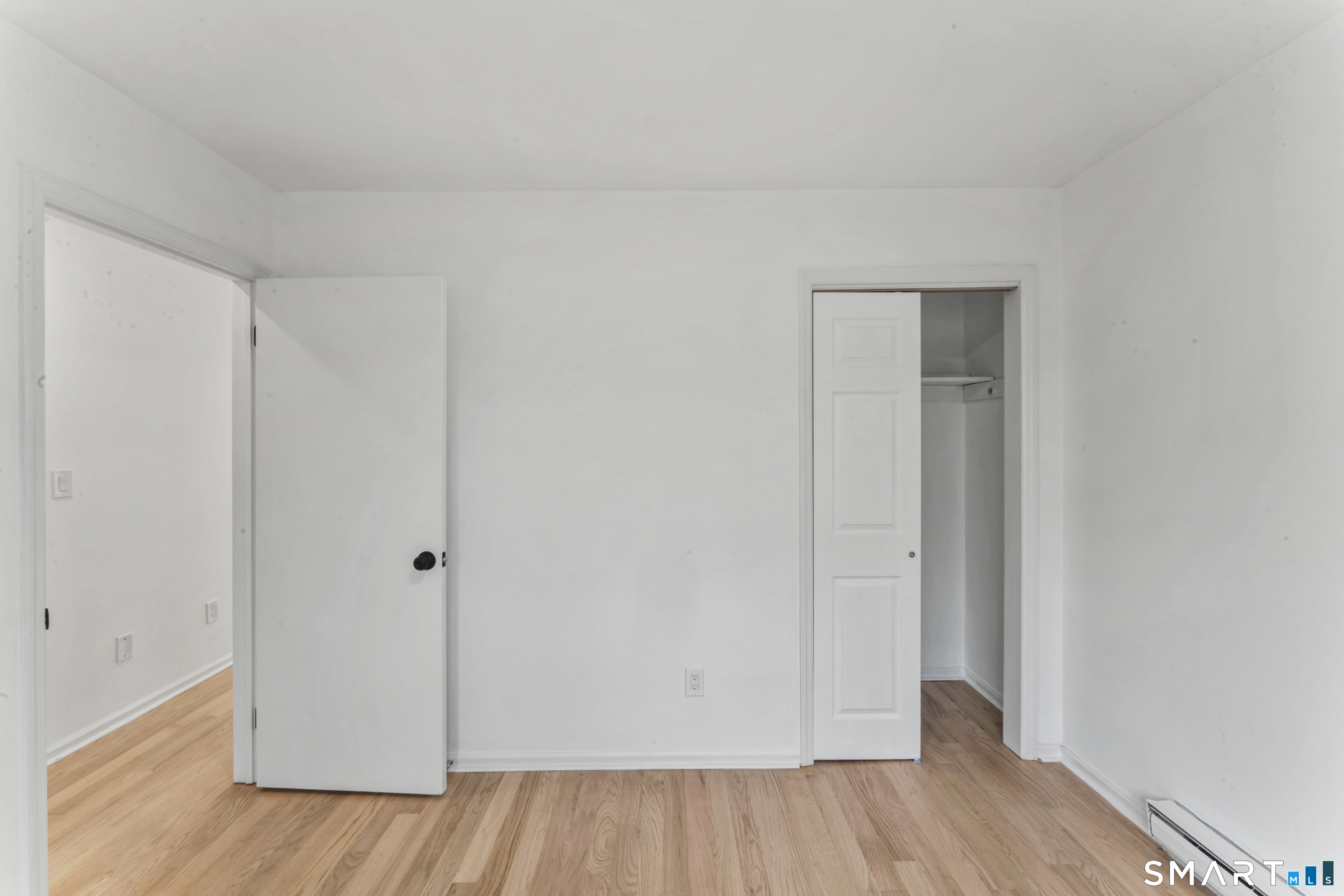 100 Maple Tree Avenue, Unit 7 Stamford, CT 06906 - Photo 23 of 38 a view of an empty room and wooden floor
