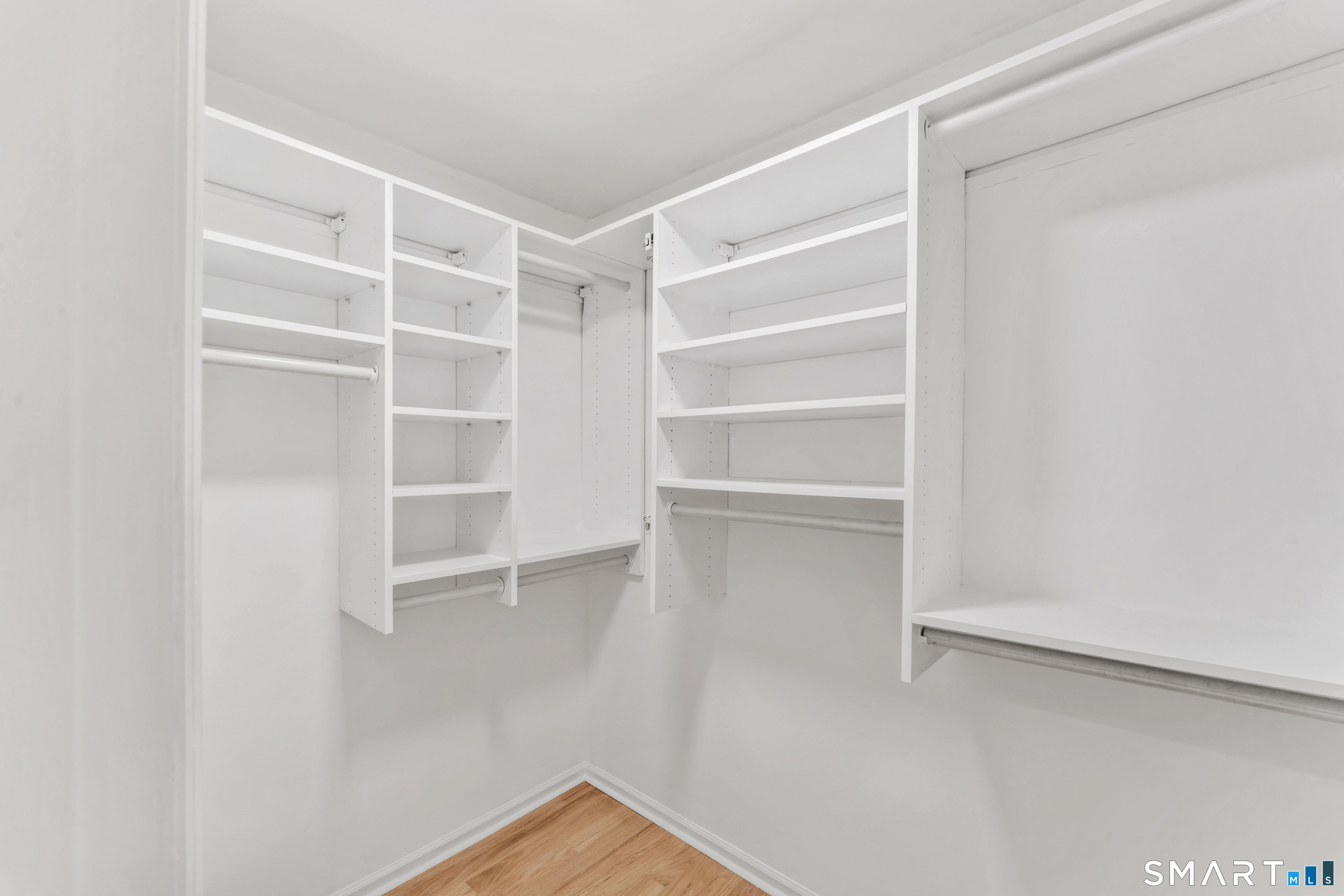 100 Maple Tree Avenue, Unit 7 Stamford, CT 06906 - Photo 28 of 38 a view of walk in closet with empty racks