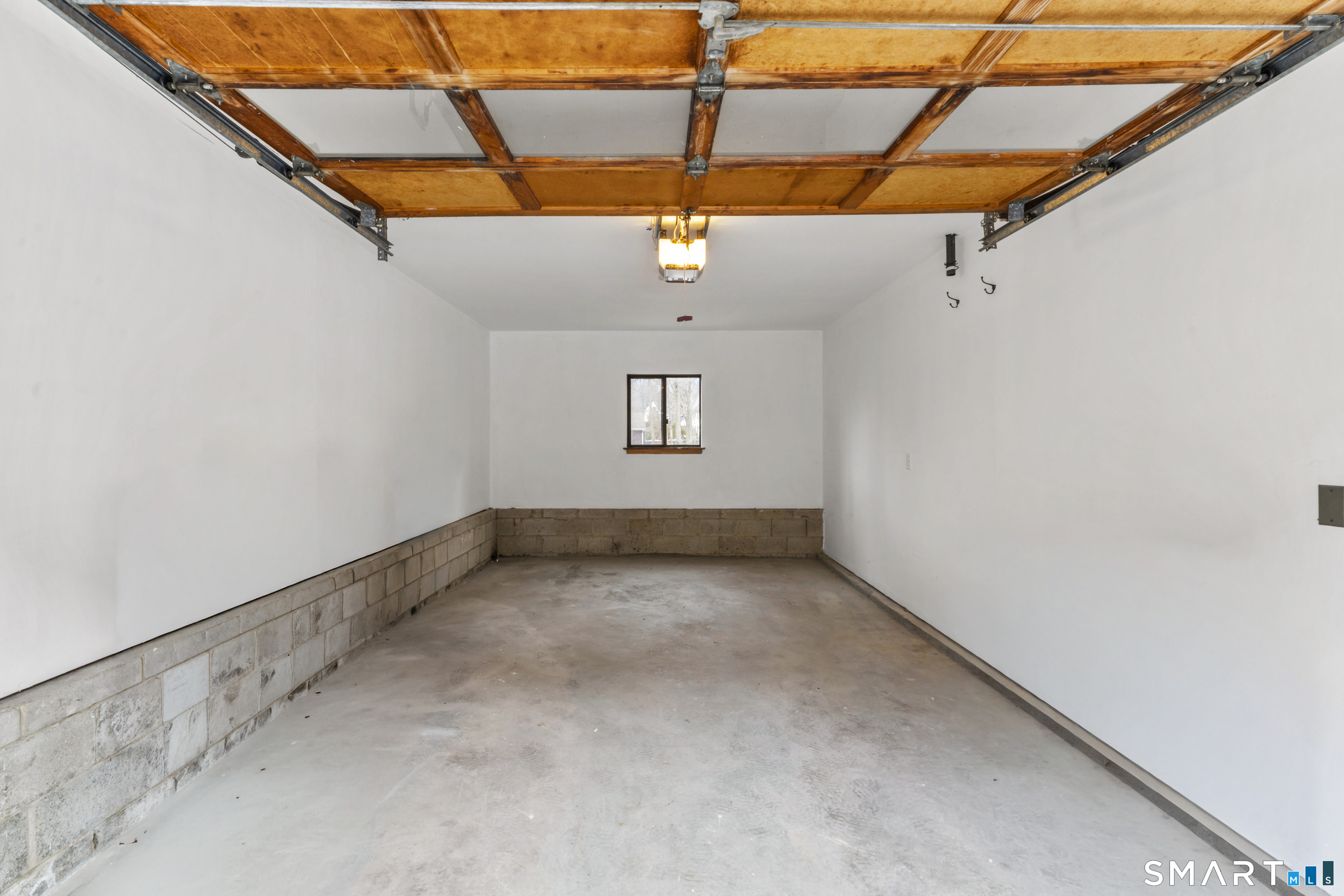 100 Maple Tree Avenue, Unit 7 Stamford, CT 06906 - Photo 33 of 38 a view of a room with exposed radiator and window
