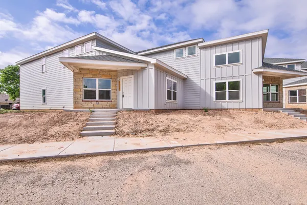 front view of a house with a dry yard