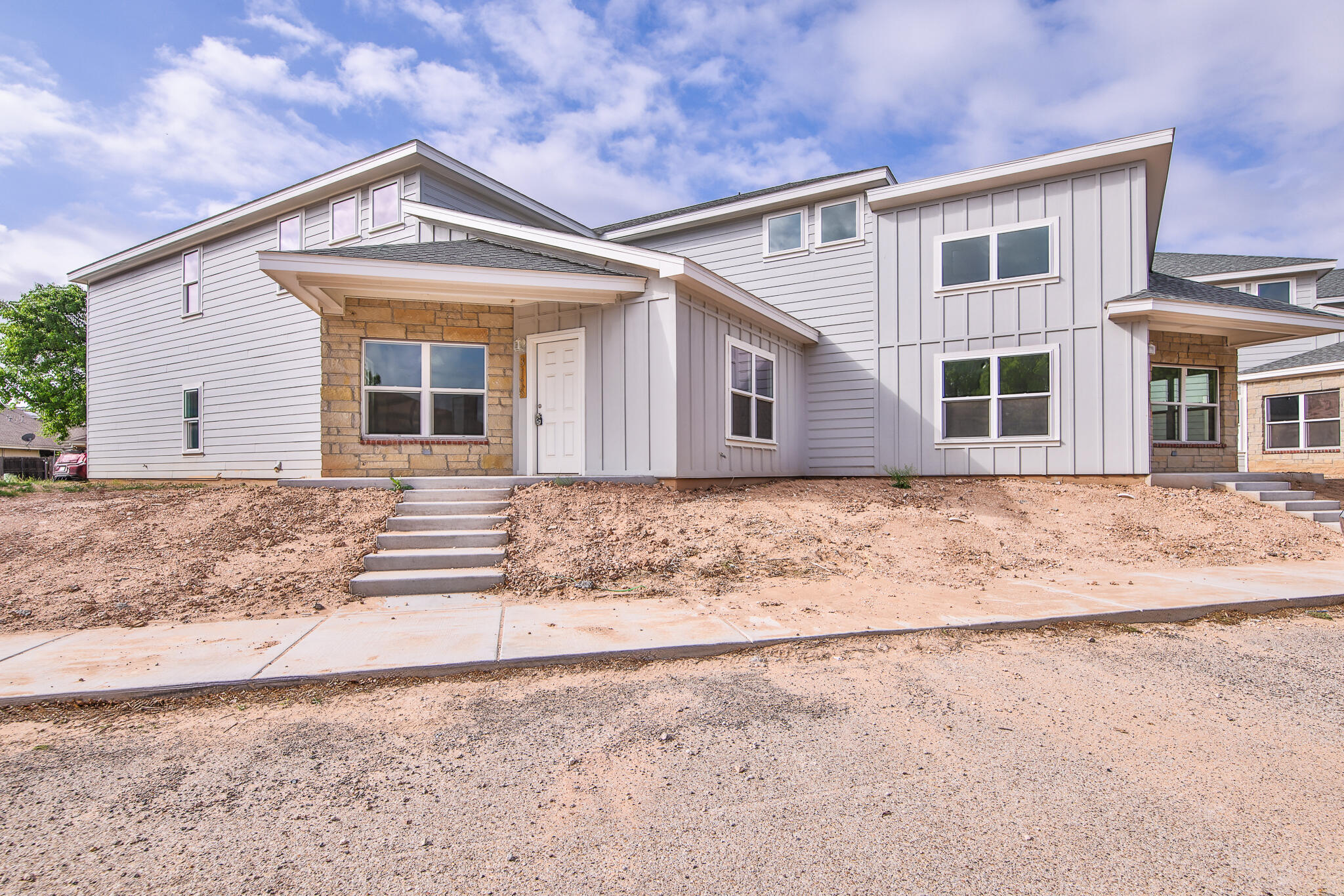 front view of a house with a dry yard