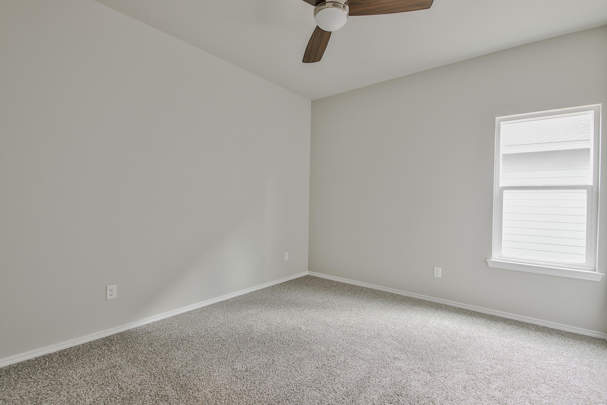 3115-3117 74th Street Lubbock, TX 79423 - Photo 17 of 37 an empty room with a window