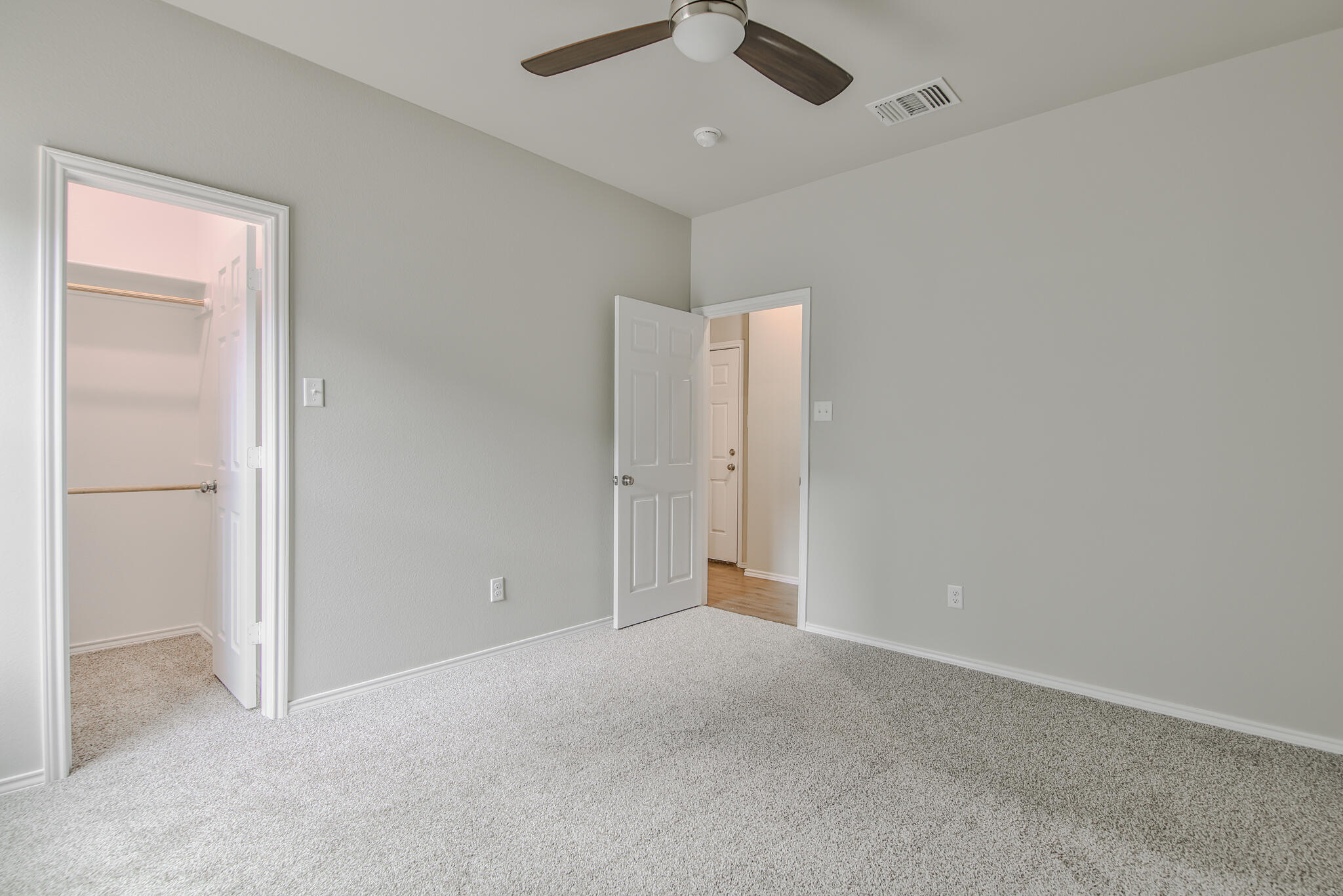 3115-3117 74th Street Lubbock, TX 79423 - Photo 19 of 37 an empty room with a empty space and a ceiling fan