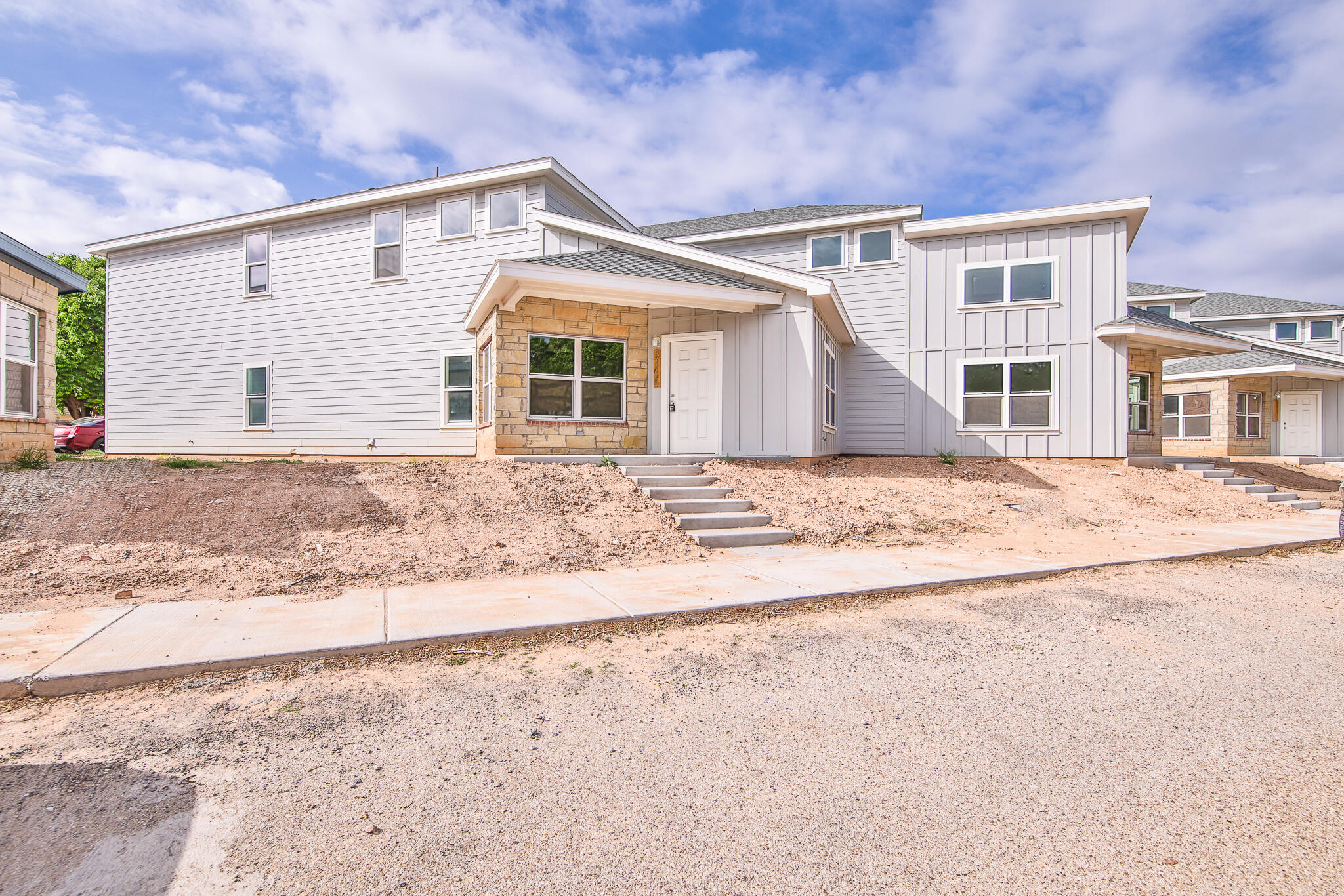 3115-3117 74th Street Lubbock, TX 79423 - Photo 3 of 37 a front view of a house with a yard