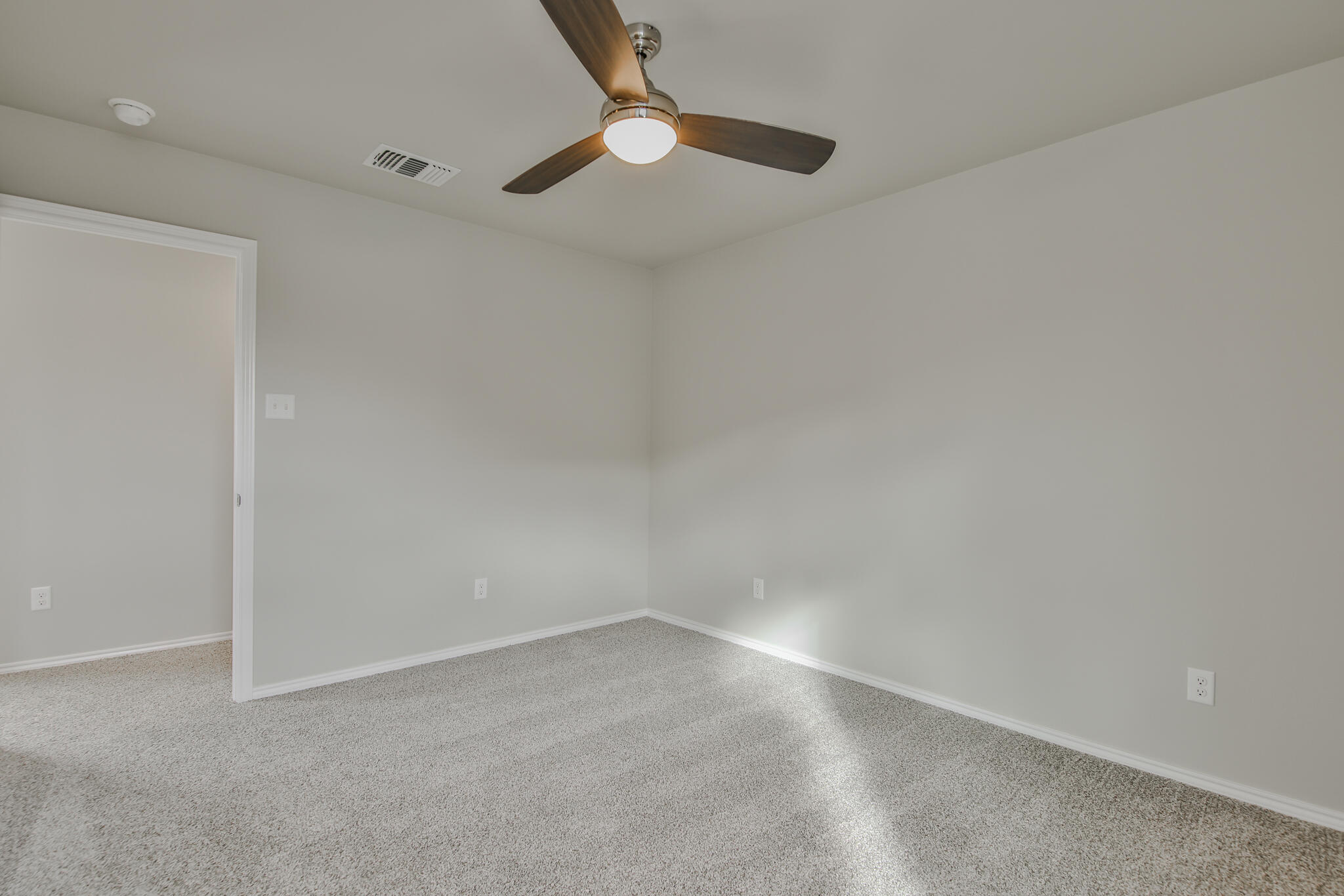 3115-3117 74th Street Lubbock, TX 79423 - Photo 31 of 37 a view of an empty room with a fan