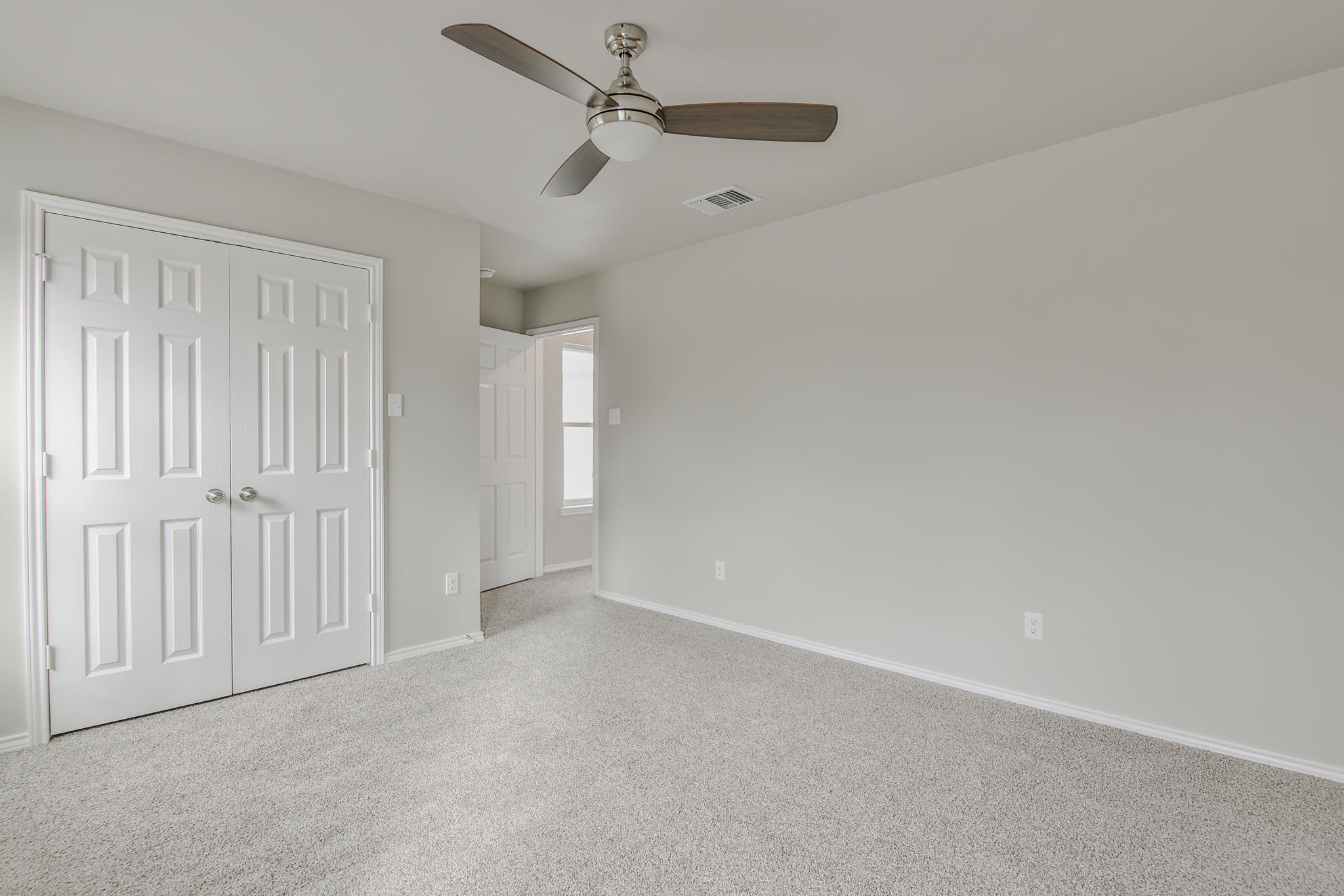 3115-3117 74th Street Lubbock, TX 79423 - Photo 35 of 37 an empty room with a ceiling fan