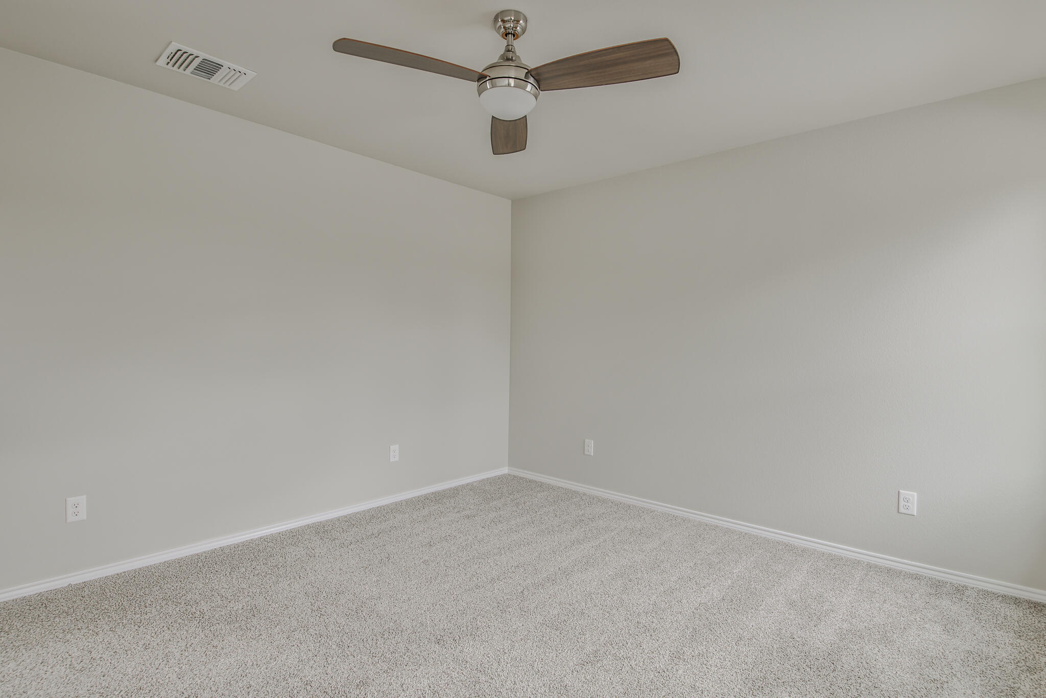 3115-3117 74th Street Lubbock, TX 79423 - Photo 36 of 37 en empty room with a fan