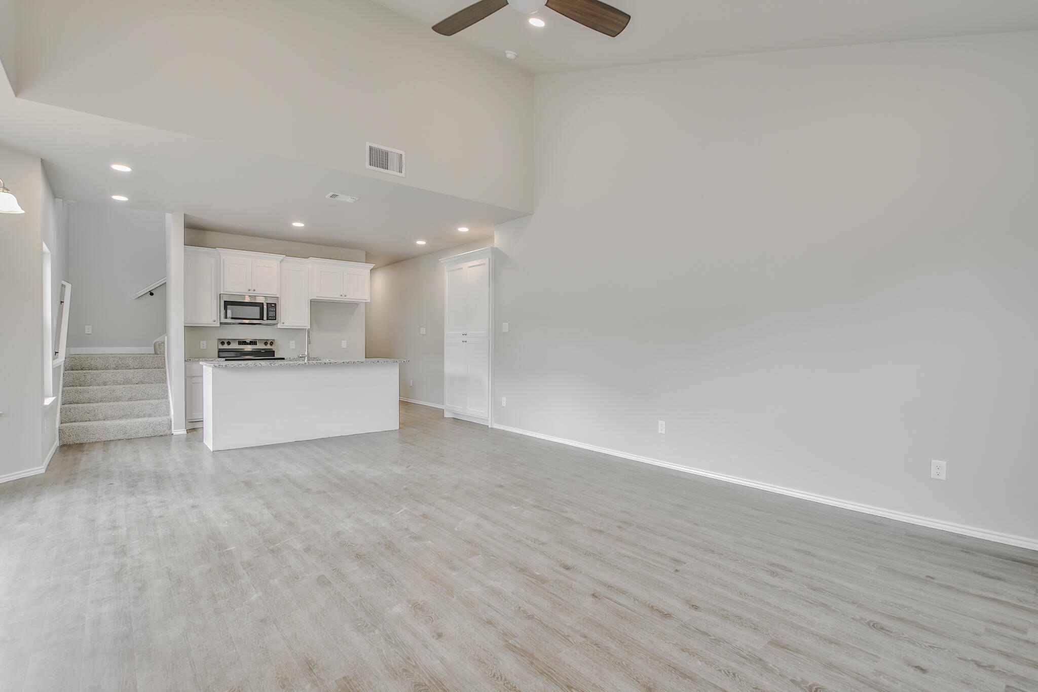 3115-3117 74th Street Lubbock, TX 79423 - Photo 37 of 37 a view of kitchen with refrigerator and white cabinets