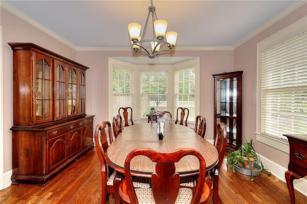 317 North Cherokee Road Social Circle, GA 30025 - Photo 12 of 32 a view of a dining room with furniture window and wooden floor