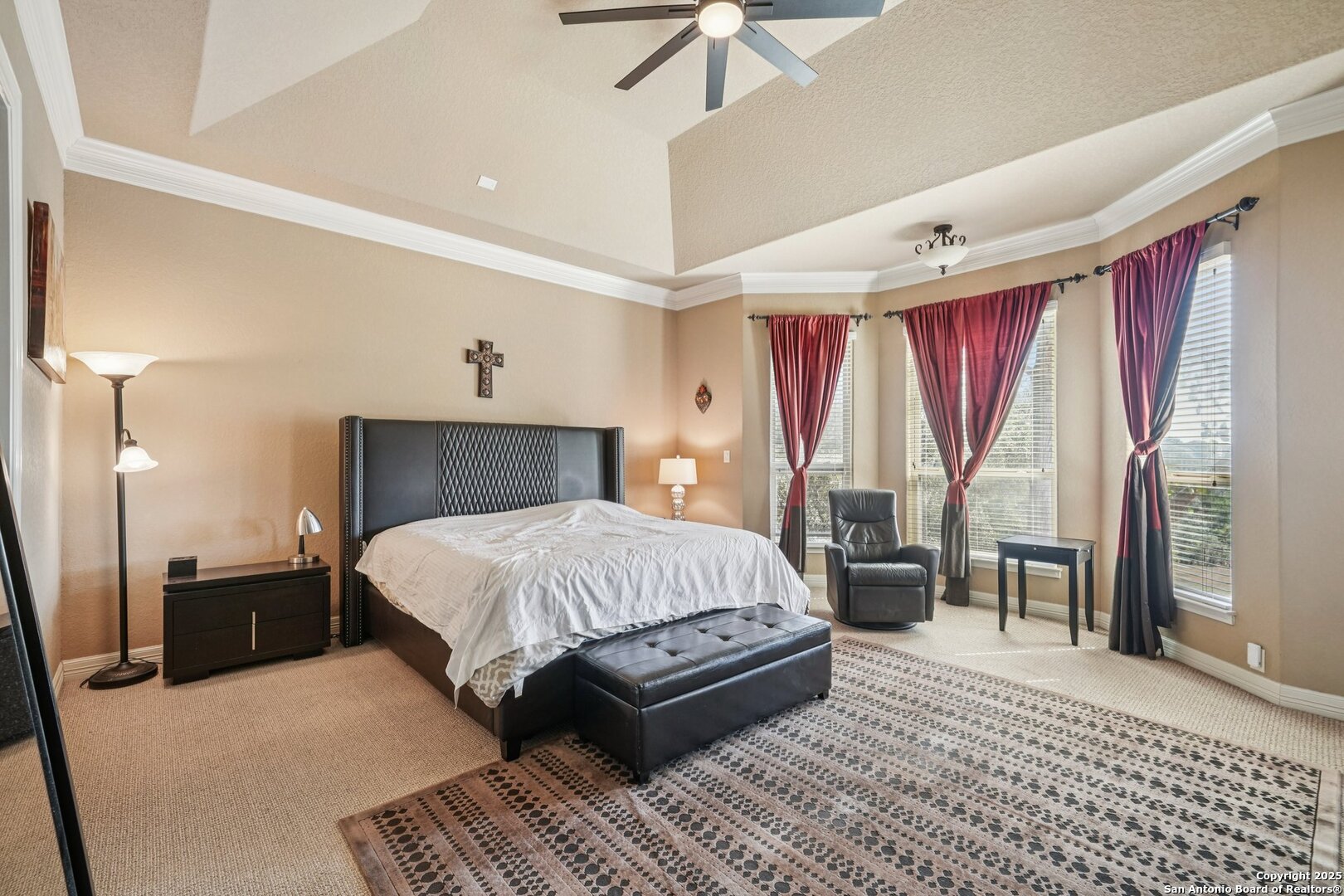718 Ruidosa Downs Helotes, TX 78023 - Photo 50 of 50 a spacious bedroom with a large bed and a chandelier