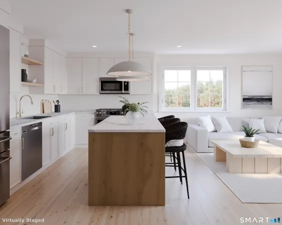 a kitchen with a table chairs stove and cabinets