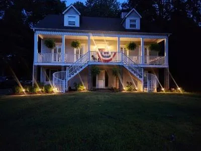 a front view of house with yard and outdoor seating