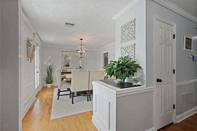 a workspace with furniture and a chandelier